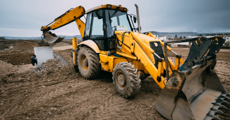 Loader backhoe working at a construction site.
